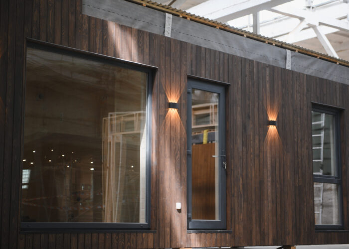 dark wooden solid wall panels with windows installed